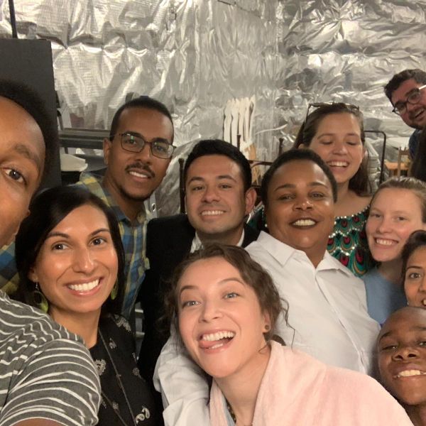 A group of people smiles for the camera.