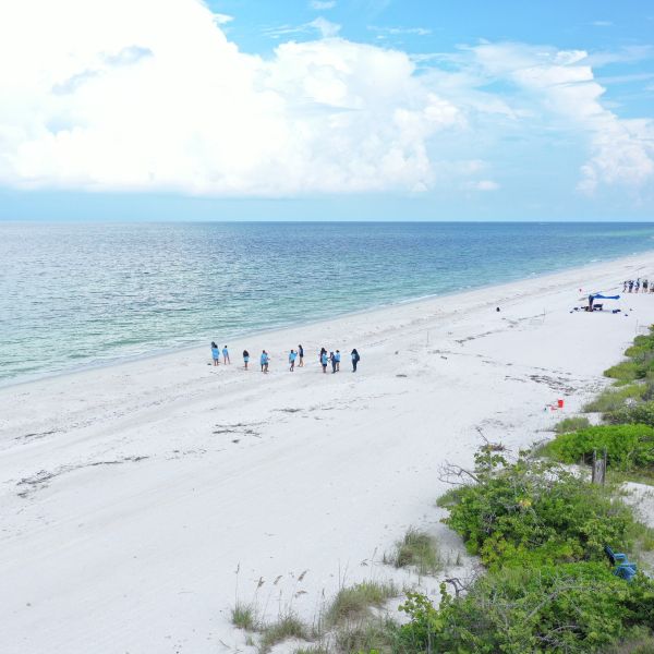 Educator teaches water quality and sea-level rise to Project WATERS participants.