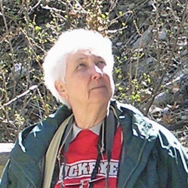 Joan Heidelberg outside looking up