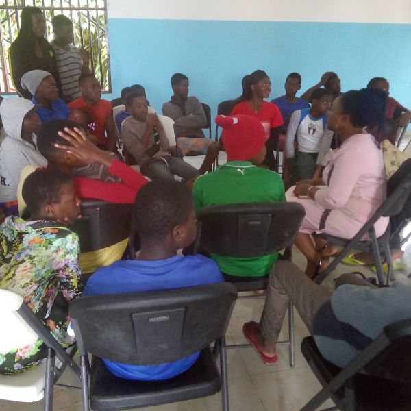 Students in Government Primary School Upstation discuss the impact of plastic waste in the community.