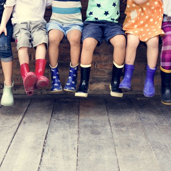 Childrens' boots in a variety of bright colors. 