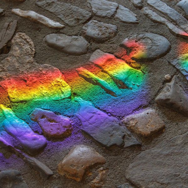 rainbow colors on grey cobblestone
