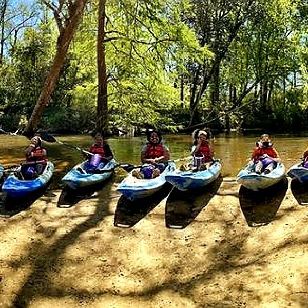 ReNEW Schaumburg Elementary middle school 21CCLC students pause at a sandbar on a kayak trip to test for pollutants at the Bogue Falaya. Photo credit: Matt May.