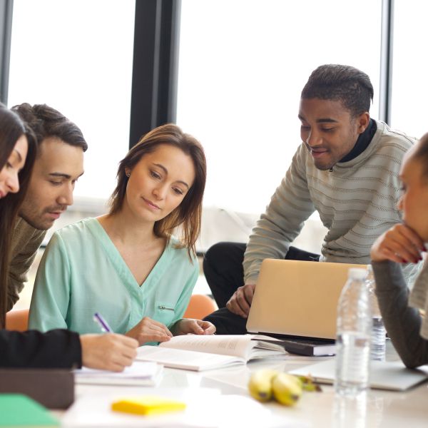 group of people collaborating around a table 