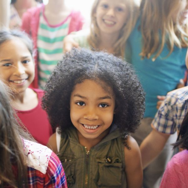 Group of school children smiling at camera