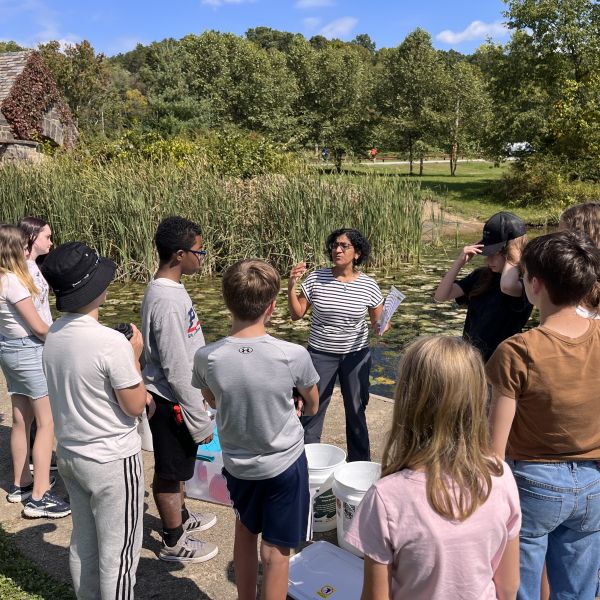 ECS Climate Action Students discuss findings from a water quality study.