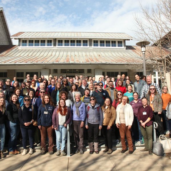 Large group of people standing outside for a photo