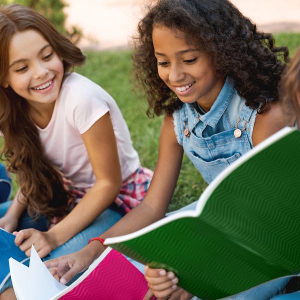 Kids outside holding books