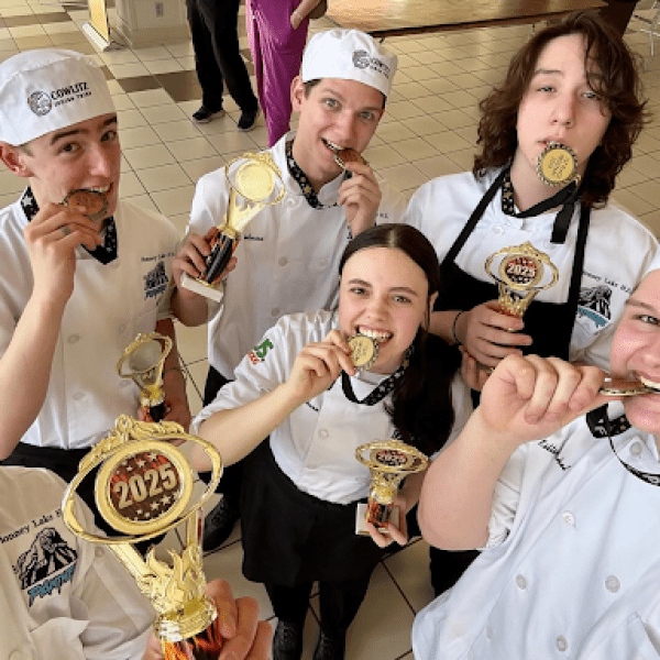 High school culinary students celebrate with award medals