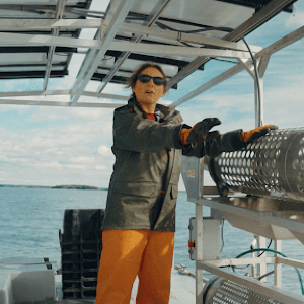 Alicia shows off the tumbler on their work barge