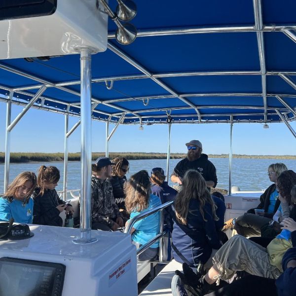 Oyster farmer teaches about aquaculture to students