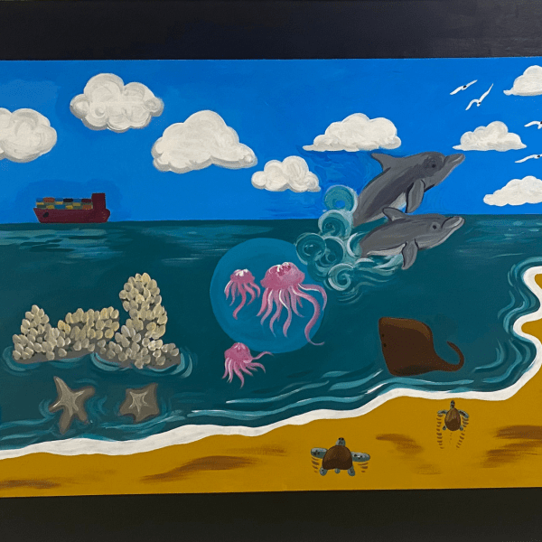 a school hallway mural depicting the beach and near-ocean animals, including dolphins, jellyfish, coral, crabs, and seashells.