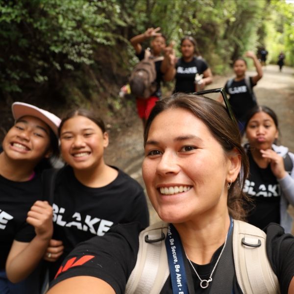 CEE-Change Fellow Ginny takes a selfie with students in New Zealand's native bush.