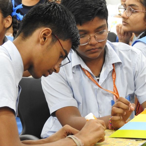 students working on a educational model together