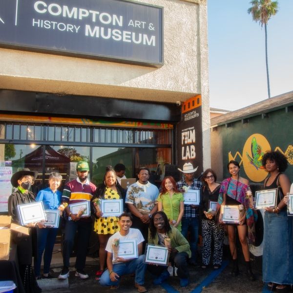 Co-curators with many of the artists featured in "We Are the Land" in front of Compton Museum.