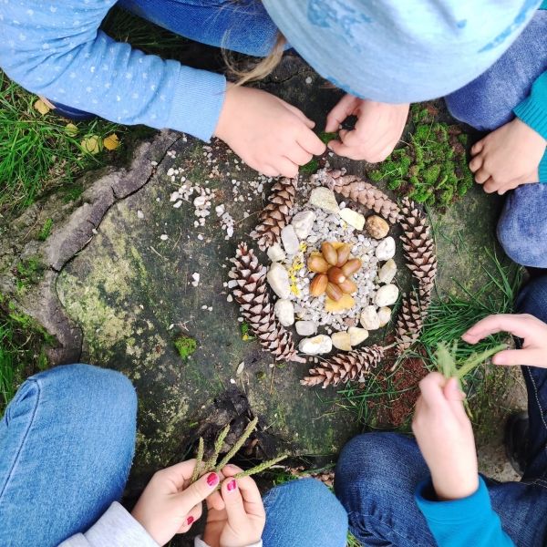 Kids make a nature mandala artwork with found natural materials
