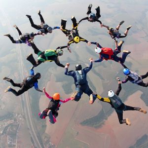 group of people skydiving in formation